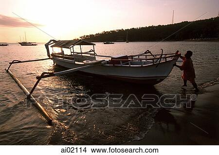 Malaysia, Kota Bahru, fishing boat ashore from South China Sea. View Large Photo Image Picture - Malaysia, Kota Bahru, fishing boat ashore from South China Sea.. Fotosearch