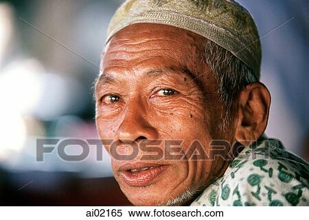 Stock Photography - Malaysia, Kota Bahru, Muslim fisherman wears islamic skull cap.. Fotosearch