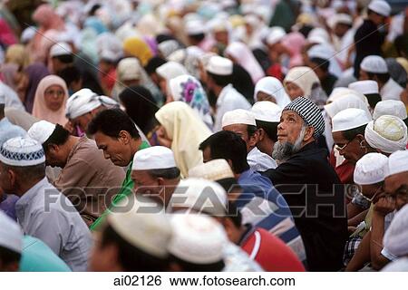 Malaysia, Kota Bahru, Muslims sit on dusty streets to listen to Pan -Malaysian Islamic Party speech. View Large Photo Image Stock Photograph - Malaysia, Kota Bahru, Muslims sit on dusty streets to listen to Pan -Malaysian Islamic Party speech.. Fotosearch
