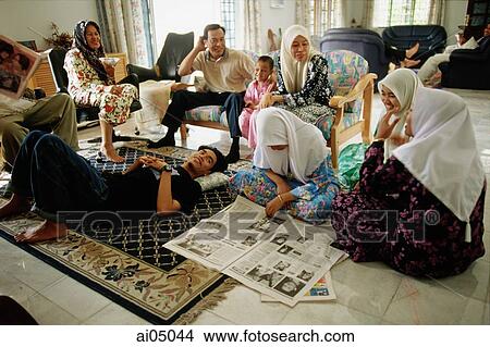 Malaysia, Kota Bharu, a Muslim family passes the Hari Raya Adilfitri holiday. View Large Photo Image Picture - Malaysia, Kota Bharu, a Muslim family passes the Hari Raya Adilfitri holiday.. Fotosearch