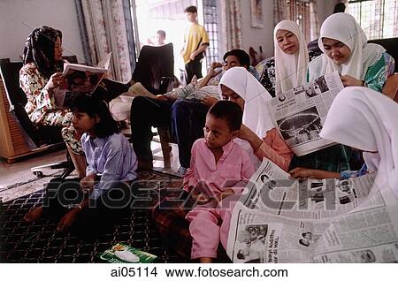 Malaysia, Kota Bharu, a Muslim family passes the Hari Raya Adilfitri holiday. View Large Photo Image Picture - Malaysia, Kota Bharu, a Muslim family passes the Hari Raya Adilfitri holiday.. Fotosearch