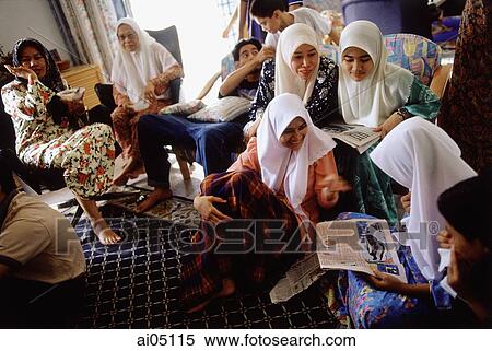 Malaysia, Kota Bharu, a Muslim family passes the Hari Raya Adilfitri holiday. View Large Photo Image Stock Photography - Malaysia, Kota Bharu, a Muslim family passes the Hari Raya Adilfitri holiday.. Fotosearch