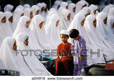 Malaysia, Kota Bharu, Children accompany their mothers during Friday prayer at Kubang Kerian Mosque. View Large Photo Image Stock Photograph - Malaysia, Kota Bharu, Children accompany their mothers during Friday prayer at Kubang Kerian Mosque.. Fotosearch
