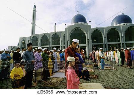 Malaysia, Kota Bharu, Fathers and sons standing in neat rows at Kubang Kerian Mosque during Friday prayers. View Large Photo Image Stock Photograph - Malaysia, Kota Bharu, Fathers and sons standing in neat rows at Kubang Kerian Mosque during Friday prayers.. Fotosearch