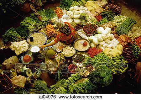 Malaysia, Kota Bharu, two women tending a vegetable stall at Central Market. View Large Photo Image Stock Photograph - Malaysia, Kota Bharu, two women tending a vegetable stall at Central Market.. Fotosearch