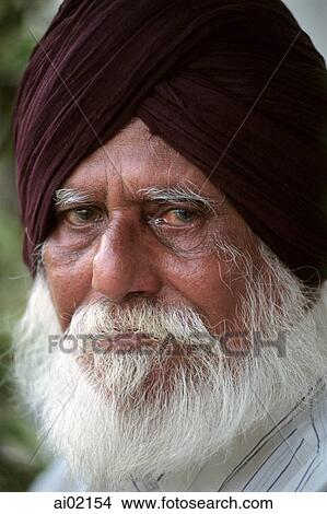 Malaysia, Kuala Lumpur, Bearded Sikh man stands outside a temple. View Large Photo Image Picture - Malaysia, Kuala Lumpur, Bearded Sikh man stands outside a temple.. Fotosearch