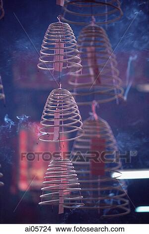 Malaysia, Kuala Lumpur, Chinatown, Burning incense coils hanging from ceiling. View Large Photo Image Picture - Malaysia, Kuala Lumpur, Chinatown, Burning incense coils hanging from ceiling.. Fotosearch