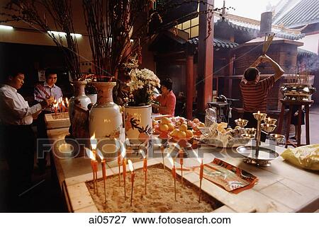 Stock Photo - Malaysia, Kuala Lumpur, Chinatown, Devotees praying at Chinese temple.. Fotosearch
