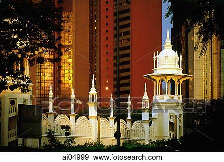 Malaysia, Kuala Lumpur, Domes and archways of the Kuala Lumpur Railway Station contrast skyline. View Large Photo Image Stock Photo - Malaysia, Kuala Lumpur, Domes and archways of the Kuala Lumpur Railway Station contrast skyline.. Fotosearch