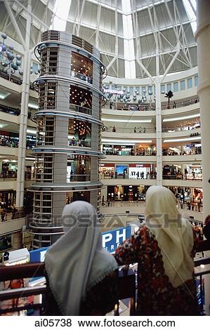 Stock Photo - Malaysia, Kuala Lumpur, Malaysians inside the Kuala Lumpur City Center shopping mall.. Fotosearch