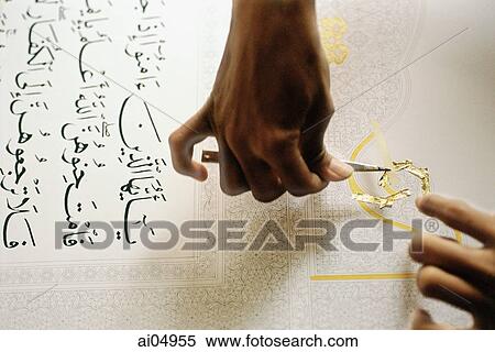 Malaysia, Kuala Lumpur, man applying gold leaf onto manuscript of the Koran. View Large Photo Image Stock Photography - Malaysia, Kuala Lumpur, man applying gold leaf onto manuscript of the Koran.. Fotosearch