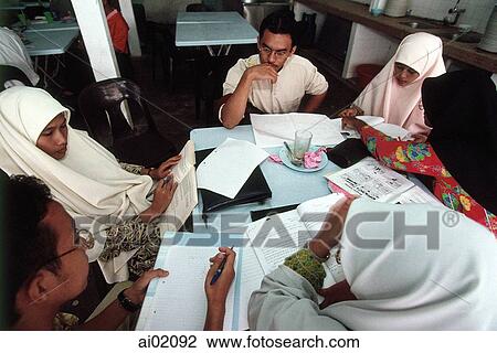 Malaysia, Kuala Lumpur, Muslim men and women study together at the International Islamic University. View Large Photo Image Stock Image - Malaysia, Kuala Lumpur, Muslim men and women study together at the International Islamic University.. Fotosearch