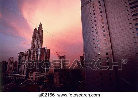 Malaysia, Kuala Lumpur, Petronas Towers at dusk. View Large Photo Image Stock Photograph - Malaysia, Kuala Lumpur, Petronas Towers at dusk.. Fotosearch