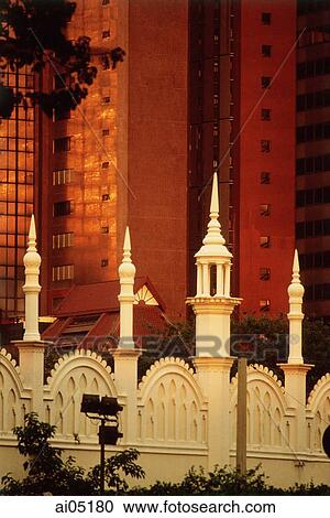 Malaysia, Kuala Lumpur, Spires of an old railway station rise against modern buildings. View Large Photo Image Stock Image - Malaysia, Kuala Lumpur, Spires of an old railway station rise against modern buildings.. Fotosearch