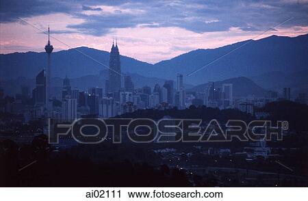 Stock Image - Malaysia, Kuala Lumpur, sunrise over the capital city.. Fotosearch