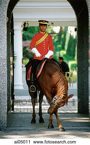 Malaysia, Kuala Lumpur, The horse of a guard at the Istana Negara (National Palace) bowing to tourists. View Large Photo Image Stock Image - Malaysia, Kuala Lumpur, The horse of a guard at the Istana Negara (National Palace) bowing to tourists.. Fotosearch