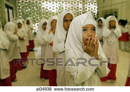 Malaysia, Kuala Lumpur, young children praying together at an Islamic kindergarten at the National Mosque. View Large Photo Image Stock Photo - Malaysia, Kuala Lumpur, young children praying together at an Islamic kindergarten at the National Mosque.. Fotosearch