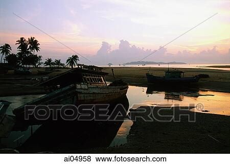 Malaysia, Marang, Dawn breaks over South China Sea. View Large Photo Image Stock Photo - Malaysia, Marang, Dawn breaks over South China Sea.. Fotosearch