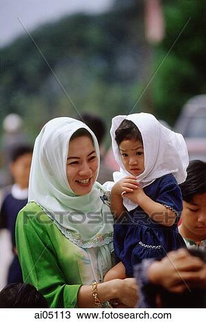 Malaysia, Muslim woman and her child. View Large Photo Image Stock Image - Malaysia, Muslim woman and her child.. Fotosearch
