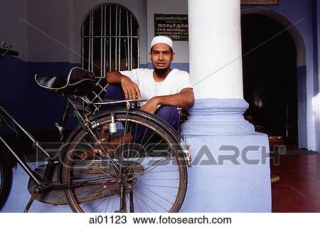 Malaysia, Penang, George Town. Muslim man at Aacheen St. Mosque View Large Photo Image Stock Image - Malaysia, Penang, George Town. Muslim man at Aacheen St. Mosque. Fotosearch