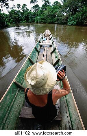 Malaysia, Sarawak, Gunung Mulu National Park, tourist with video camera on river boat trip View Large Photo Image Stock Image - Malaysia, Sarawak, Gunung Mulu National Park, tourist with video camera on river boat trip. Fotosearch