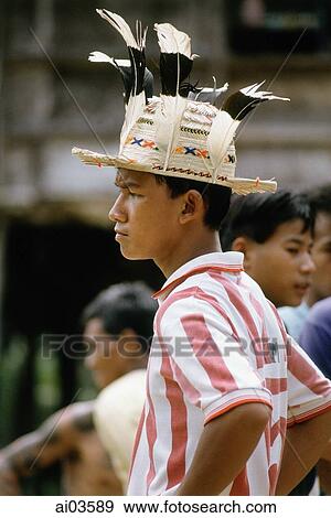 Malaysia, Sarawak, modern Iban boy wearing hat View Large Photo Image Stock Photo - Malaysia, Sarawak, modern Iban boy wearing hat. Fotosearch