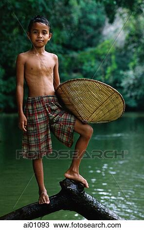 Malaysia, Sarawak, Sri Aman Division, Engkilili, Iban Boy at riverside View Large Photo Image Stock Image - Malaysia, Sarawak, Sri Aman Division, Engkilili, Iban Boy at riverside. Fotosearch