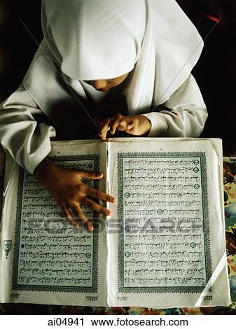 Malaysia, Selangor, Malay girl reading the Koran written in Jawi, the Malay language written in Arabic script. View Large Photo Image Stock Image - Malaysia, Selangor, Malay girl reading the Koran written in Jawi, the Malay language written in Arabic script.. Fotosearch