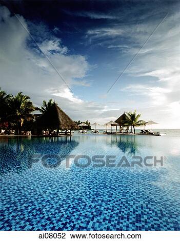 Maldives, Kuda Huraa atoll, Four Seasons Resort, Pool side. View Large Photo Image Stock Image - Maldives, Kuda Huraa atoll, Four Seasons Resort, Pool side.. Fotosearch