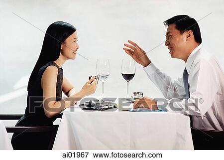 Male and female executives talking in restaurant View Large Photo Image Stock Photo - Male and female executives talking in restaurant. Fotosearch