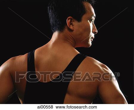 Male athlete, rear view, profile, black background View Large Photo Image Stock Photo - Male athlete, rear view, profile, black background. Fotosearch