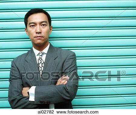 Male executive against green metal shutters, portrait. View Large Photo Image Stock Image - Male executive against green metal shutters, portrait.. Fotosearch