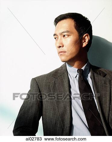 Male executive against white background, looking off camera. View Large Photo Image Stock Image - Male executive against white background, looking off camera.. Fotosearch