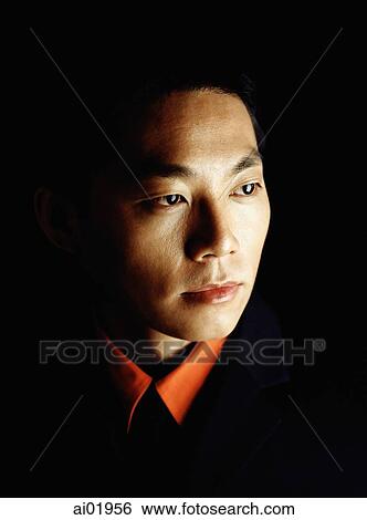 Male executive looking away, portrait, black background View Large Photo Image Stock Photograph - Male executive looking away, portrait, black background. Fotosearch