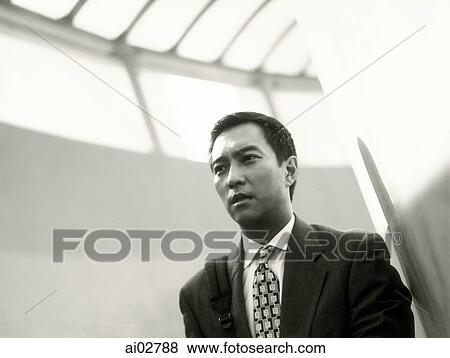 Stock Photo - Male executive looking off camera.. Fotosearch