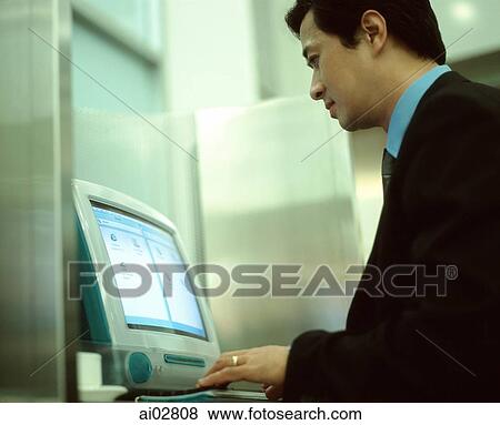 Male executive on computer View Large Photo Image Stock Photo - Male executive on computer. Fotosearch