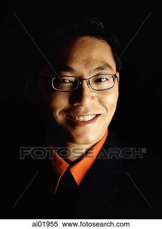Male executive smiling, portrait, black background View Large Photo Image Stock Photography - Male executive smiling, portrait, black background. Fotosearch