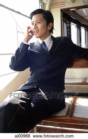 Male executive talking on cellular phone View Large Photo Image Stock Photograph - Male executive talking on cellular phone. Fotosearch