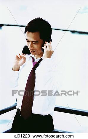 Male executive talking on cellular phone ( high grain) View Large Photo Image Stock Image - Male executive talking on cellular phone ( high grain). Fotosearch