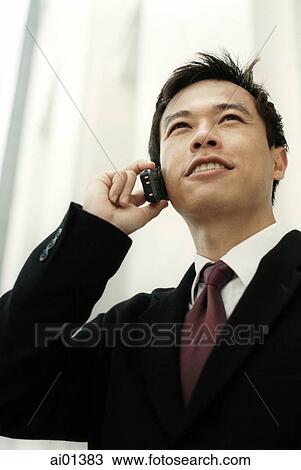 Male executive talking on cellular phone, white background. View Large Photo Image Stock Image - Male executive talking on cellular phone, white background.. Fotosearch