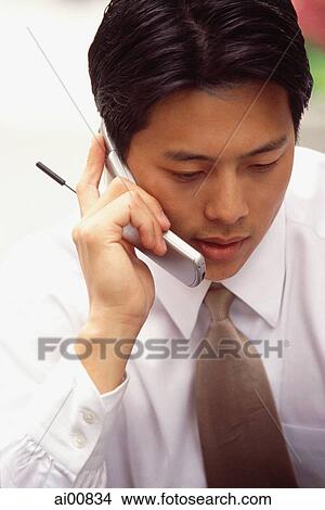 Male executive using cellular phone View Large Photo Image Picture - Male executive using cellular phone. Fotosearch