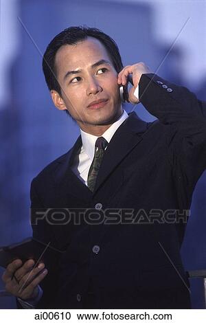 Male executive using cellular phone View Large Photo Image Stock Image - Male executive using cellular phone. Fotosearch