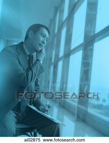 Male executive using cellular phone next to window. View Large Photo Image Stock Photography - Male executive using cellular phone next to window.. Fotosearch