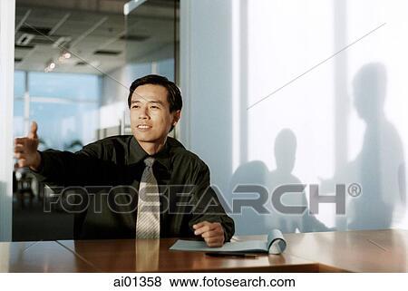Male executive with outstretched hand, shadows in background View Large Photo Image Stock Photo - Male executive with outstretched hand, shadows in background. Fotosearch