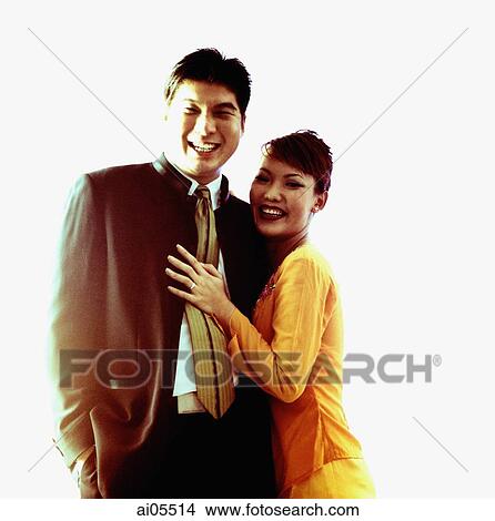 Picture - Man and woman embracing, smiling, portrait. Fotosearch