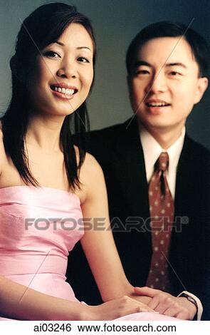 Man and woman sitting, smiling. View Large Photo Image Stock Photograph - Man and woman sitting, smiling.. Fotosearch