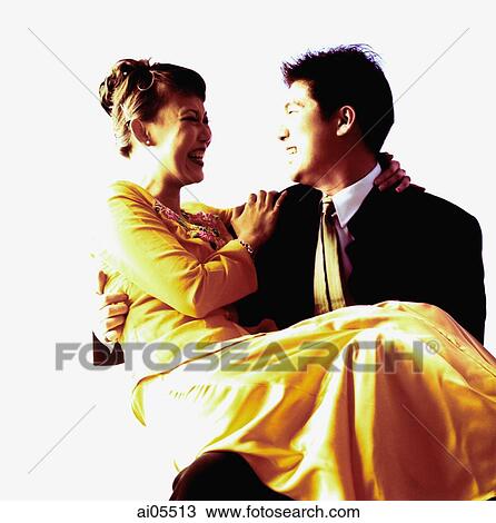 Man carrying woman. View Large Photo Image Stock Image - Man carrying woman.. Fotosearch
