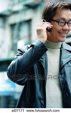 Man holding mobile phone View Large Photo Image Stock Image - Man holding mobile phone. Fotosearch