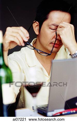 Man holding spectacles, looking stressed. View Large Photo Image Stock Image - Man holding spectacles, looking stressed.. Fotosearch