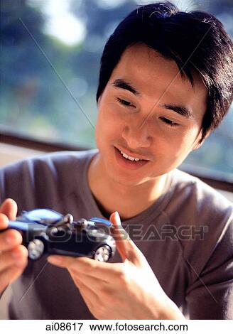 Man holding toy model car, looking, smiling. View Large Photo Image Stock Photo - Man holding toy model car, looking, smiling.. Fotosearch